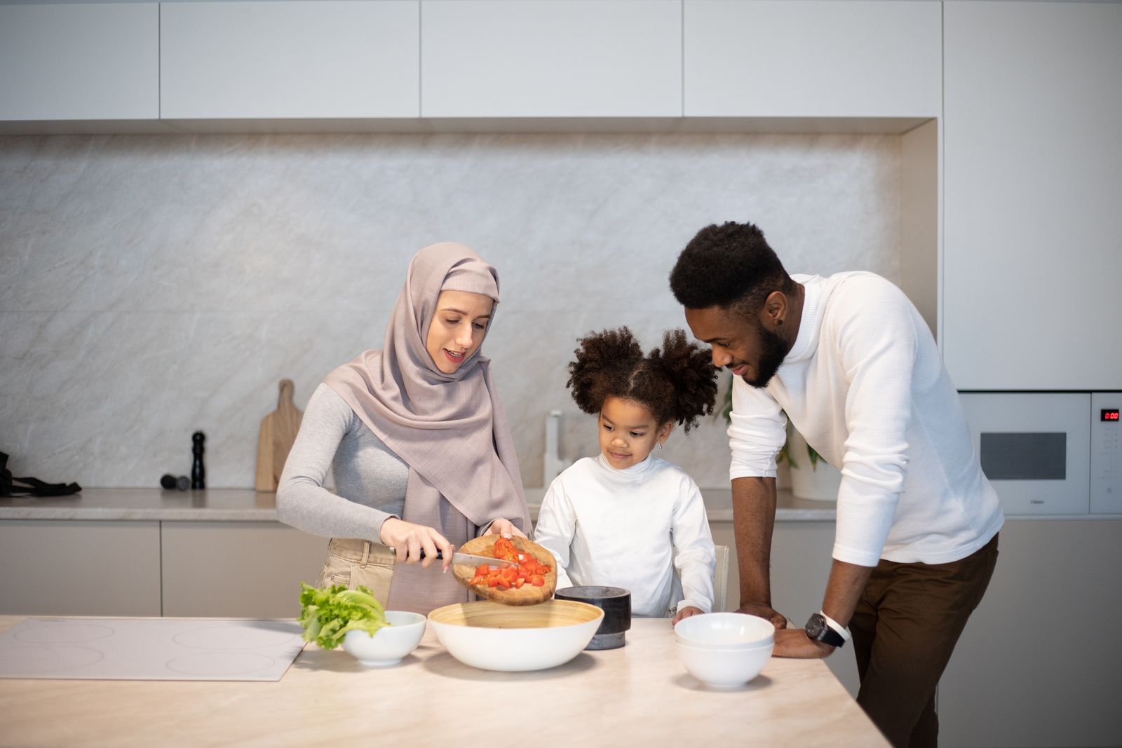 Family cooking together in a home kitchen